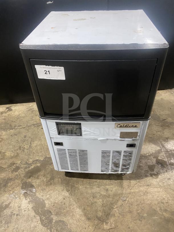 Late model 2020 Coldline ICE120-HA commercial stainless steel undercounter ice maker, 115V, on legs, minor wear visible.
