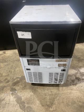 Late model 2020 Coldline ICE120-HA commercial stainless steel undercounter ice maker, 115V, on legs, minor wear visible.