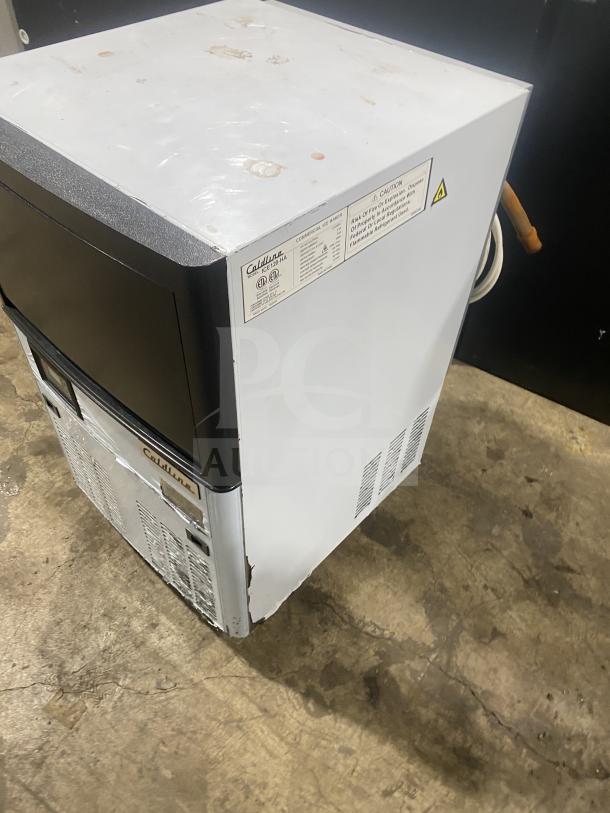 Coldline ICE120-HA commercial stainless steel undercounter ice maker, 2020 model, on legs, visible wear. 115V label shown.