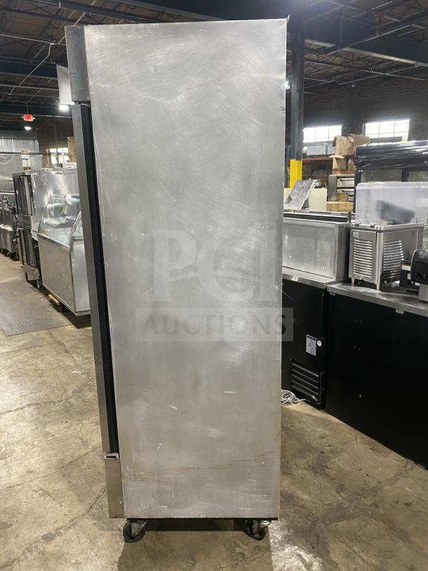 True T-49 stainless steel 2-door reach-in refrigerator on casters, Energy Star certified, with poly coated wired rack.