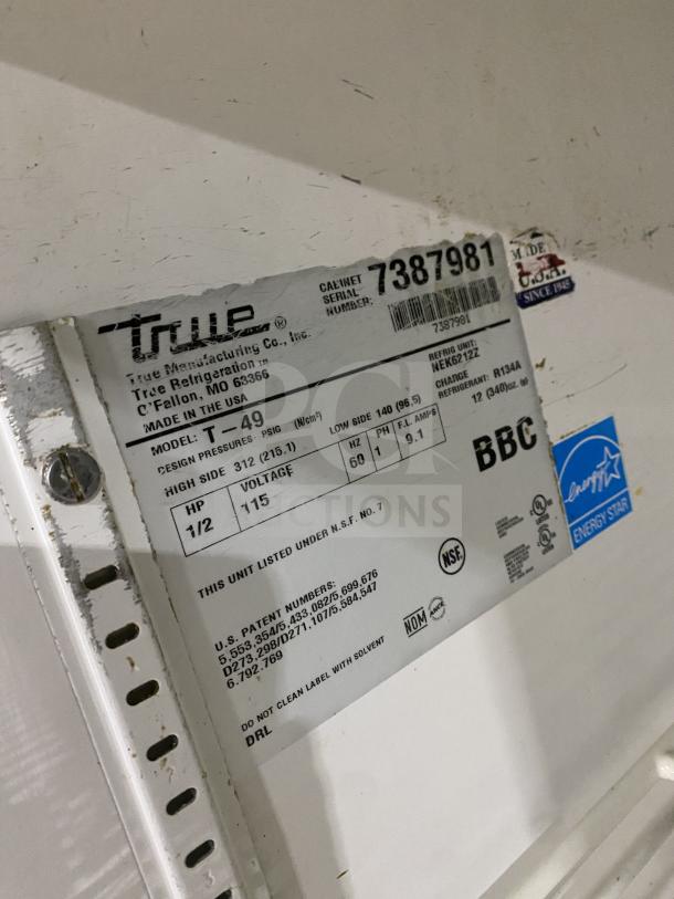 True T-49 2-Door Stainless Steel Reach-In Refrigerator, Energy Star Certified, Serial 7387981, on casters, with poly-coated racks.