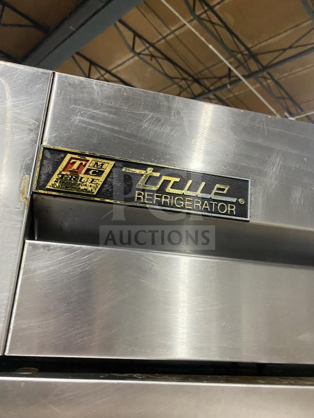 True commercial stainless steel 2-door reach-in refrigerator, Model T-49. Energy Star certified, on casters, with poly coated rack.