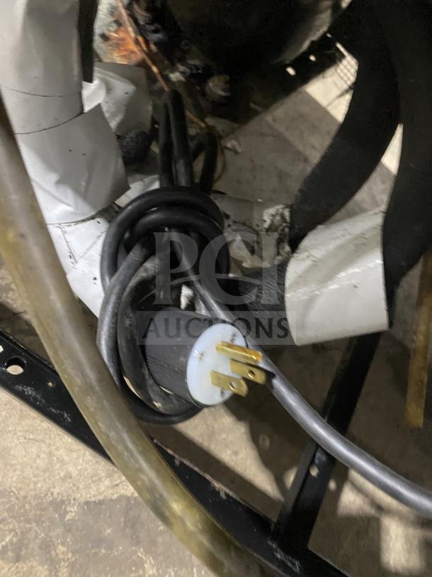 True commercial refrigerator T-49 with power cord, stainless steel, Energy Star certified, poly coated rack, on casters.