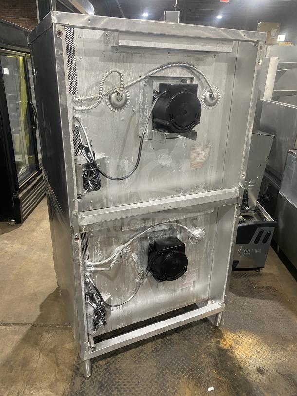 Blodgett stainless steel gas-powered double convection oven, Energy Star certified, with wired oven rack, on legs.