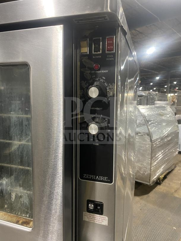 Blodgett stainless steel double stacked convection oven with control panel, wired rack, Energy Star certified, on legs.