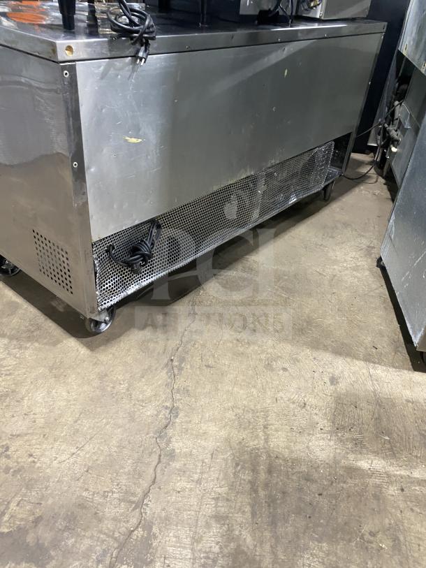 True TUC-72 stainless steel 3-door undercounter refrigerator on casters, poly-coated rack, 115V 1 Phase, SN: 6718114.