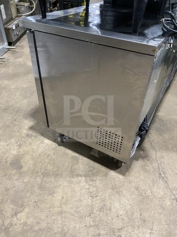 True TUC-72 stainless steel 3-door undercounter refrigerator with poly-coated wired rack, 115V, on casters, model TUC72.