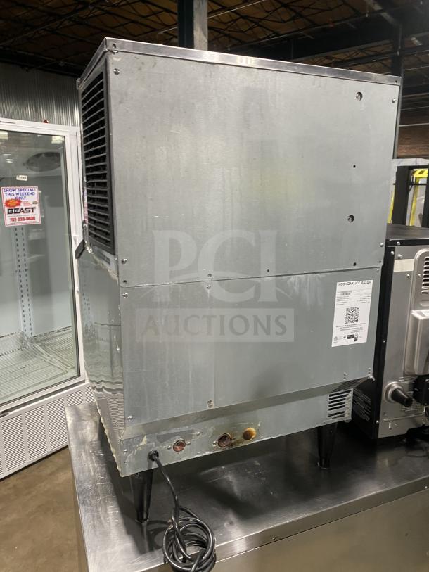 Hoshizaki KM-231BAJ ice machine, stainless steel, undercounter, with 80 lb. storage, top-hinged access, 115V, on legs.