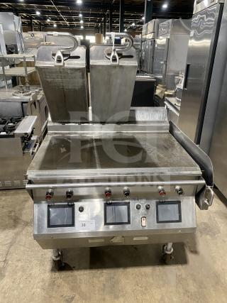 Taylor L813-23 stainless steel clamshell grill on casters, dual-sided, electric 208V 3-phase, in good condition.