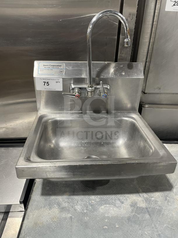 Jimex stainless steel wall-mount hand sink with backsplash and dual faucet, label indicating Jimex Corporation. Good condition.