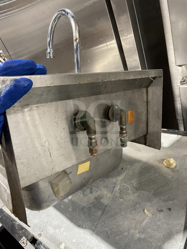 Jimex Corporation stainless steel wall-mount hand sink with backsplash, visible faucet and fittings, in used condition.