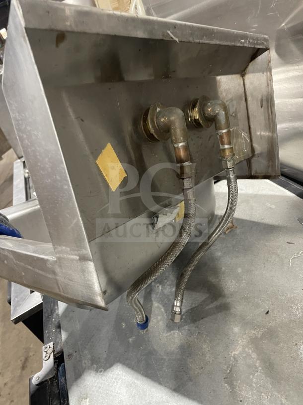 Stainless steel Jimex SSH14 wall-mount hand sink with back splash, commercial-grade, features visible plumbing connections.