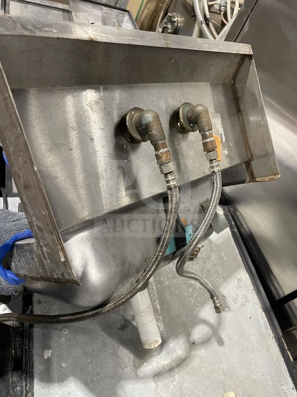 Jimex stainless steel wall-mount hand sink with backsplash, commercial grade. Features visible plumbing connections.
