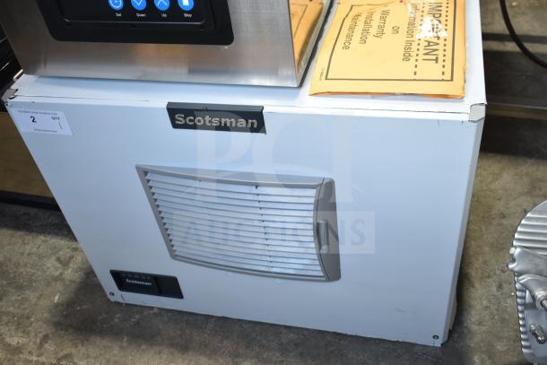 BRAND NEW Scotsman MC0330MAX-32A ice machine, 365 lb capacity, 208/230V, 1 phase. Visible warranty and maintenance packet.