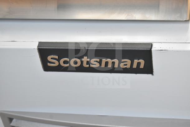 Scotsman logo on MC0330MAX-32A Prodigy Elite Series ice machine, brand new with visible scratches.