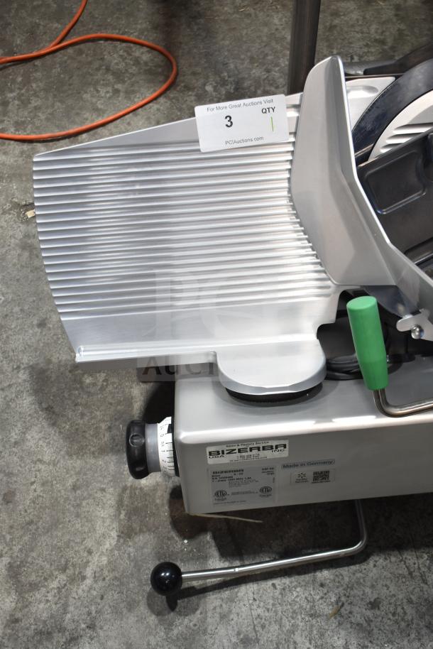 2023 Bizerba GSP HD commercial meat slicer, 120V, 1 phase. Excellent condition, stainless steel with green handle.