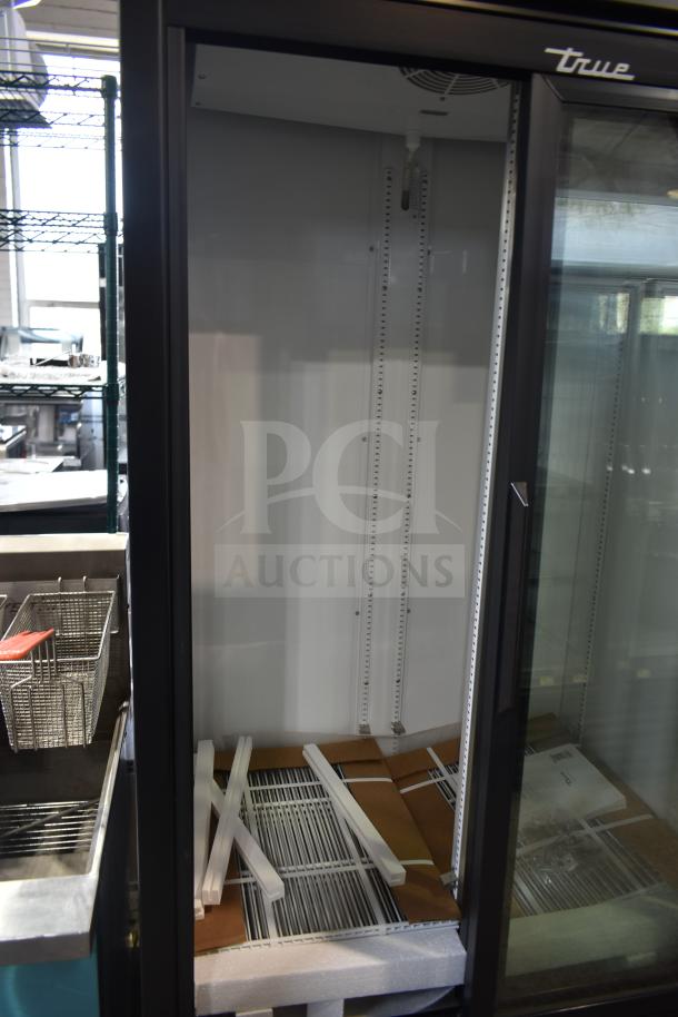 Brand new True GDM-33-HC-LD commercial 2-door reach-in cooler, 115 volts, 1 phase, interior view, scratch and dent condition.