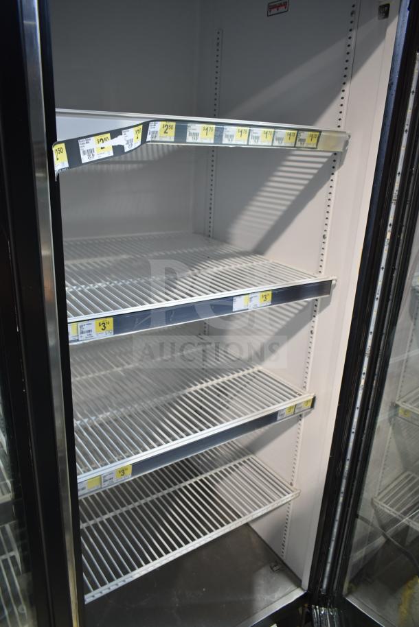 2017 True GDM-72-HC commercial 3-door reach-in cooler, white interior, metal shelves, 115 volts, tested and working.