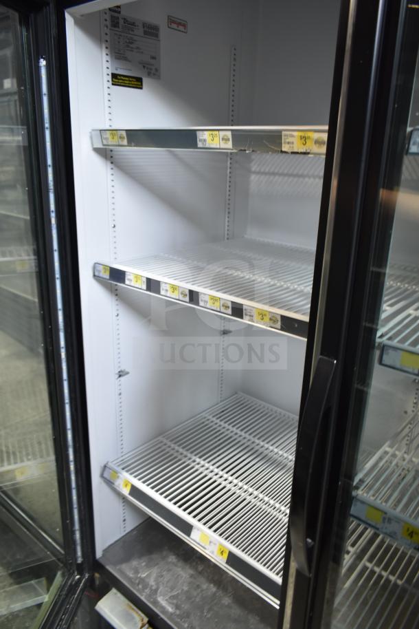 2017 True GDM-72-HC 3 Door Cooler Merchandiser, 115 Volts, tested, excellent condition, interior shelves visible.