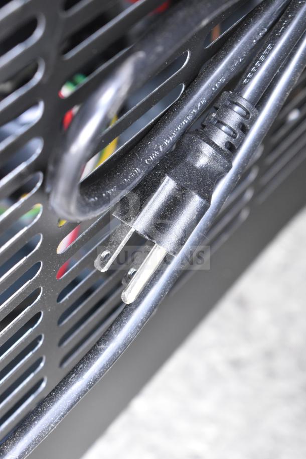 Close-up of the power cord and plug of a 2025 Avantco model 178GDC40HCB commercial cooler.