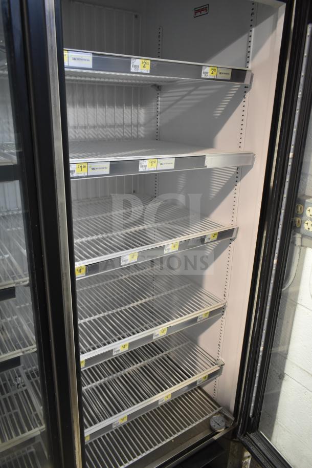 2019 True GDM-72F-HC commercial freezer, 3-door, shelves visible, 115/208-230V, 1 phase, tested and working.