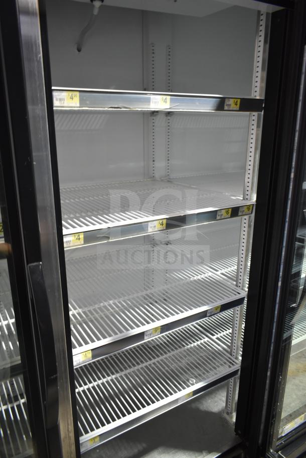 2017 True GDM-72-HC commercial 3 door reach-in cooler, shelves visible. Tested, working, 115V, 1-phase.