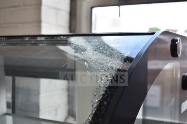 Avantco 178GDC40HCB commercial air curtain merchandiser with visible glass damage, curved black design, 115 volts, 1 phase.