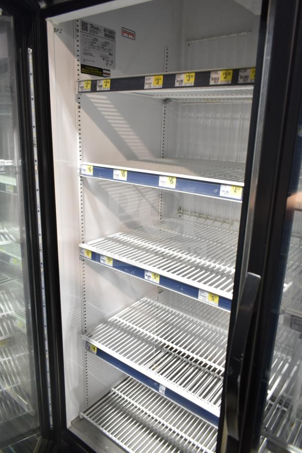 2017 True GDM-72F-HC commercial 3-door freezer merchandiser, white shelves, tested and working, True label visible.