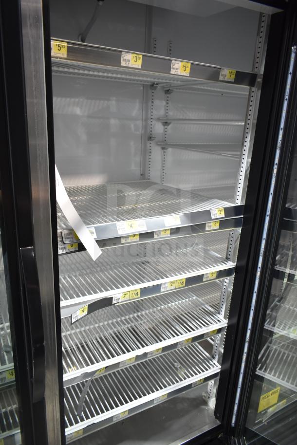 2017 True GDM-72-HC commercial cooler, 3-door, reach-in, 115 volts, tested, working, shelves with price tags.