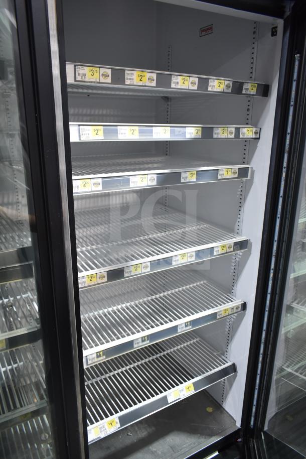 2017 True GDM-72-HC commercial 3-door cooler merchandiser, excellent condition, shelves labeled with price tags.