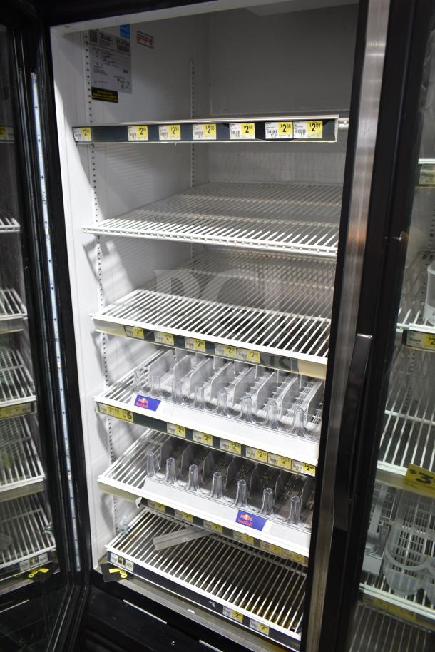 2017 True GDM-49-HC commercial cooler, 2 glass doors, white interior, 115 volts, tested and working, price tags visible.