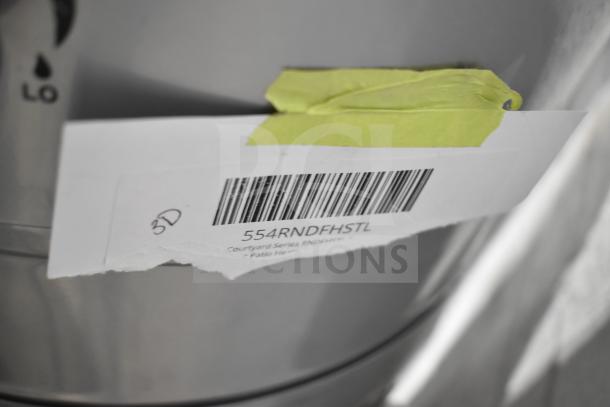 BRAND NEW Backyard Pro RNDFHSTL propane patio heater, 46,000 BTU, steel, glass tube, with tag showing model 554RNDFHSTL.