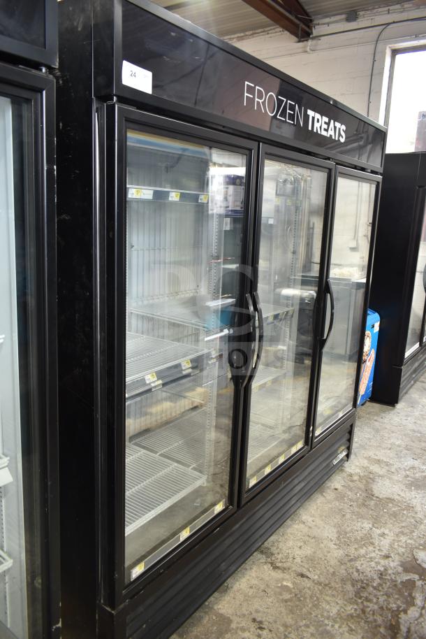 2017 True GDM-72F-HC 3-door commercial freezer merchandiser. Tested, working, 115/208-230V, 1 phase. "Frozen Treats" on display.