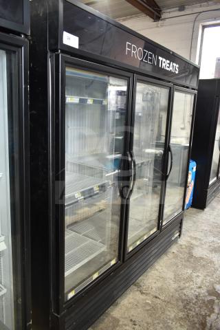2017 True GDM-72F-HC 3-door commercial freezer merchandiser. Tested, working, 115/208-230V, 1 phase. "Frozen Treats" on display.