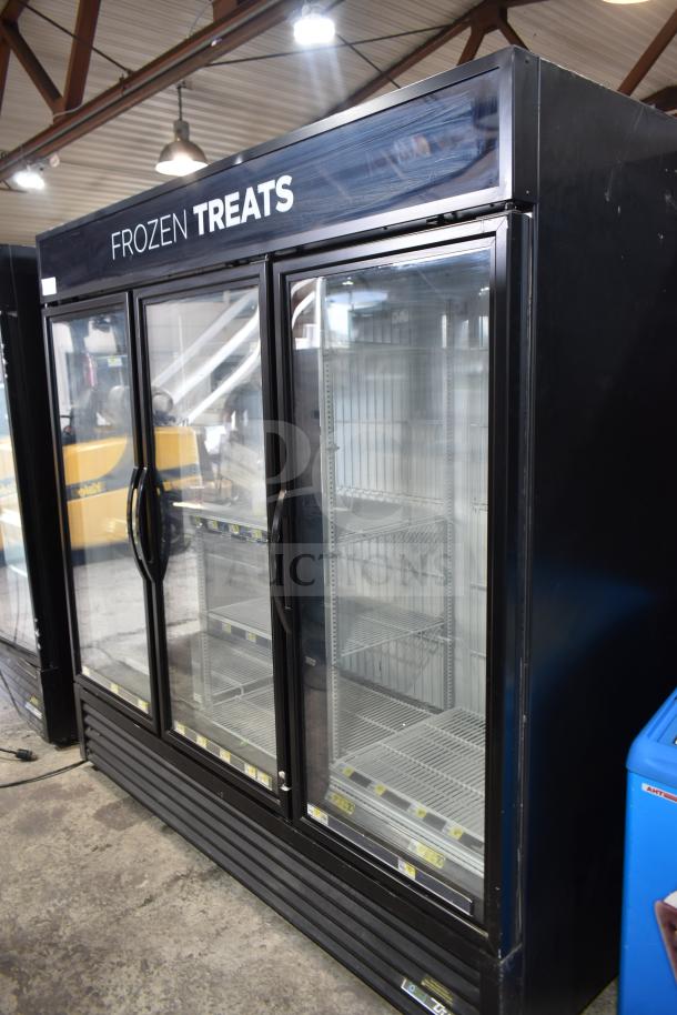 2017 True GDM-72F-HC commercial freezer, 3-door, tested working, glass front, "Frozen Treats" label, excellent condition.