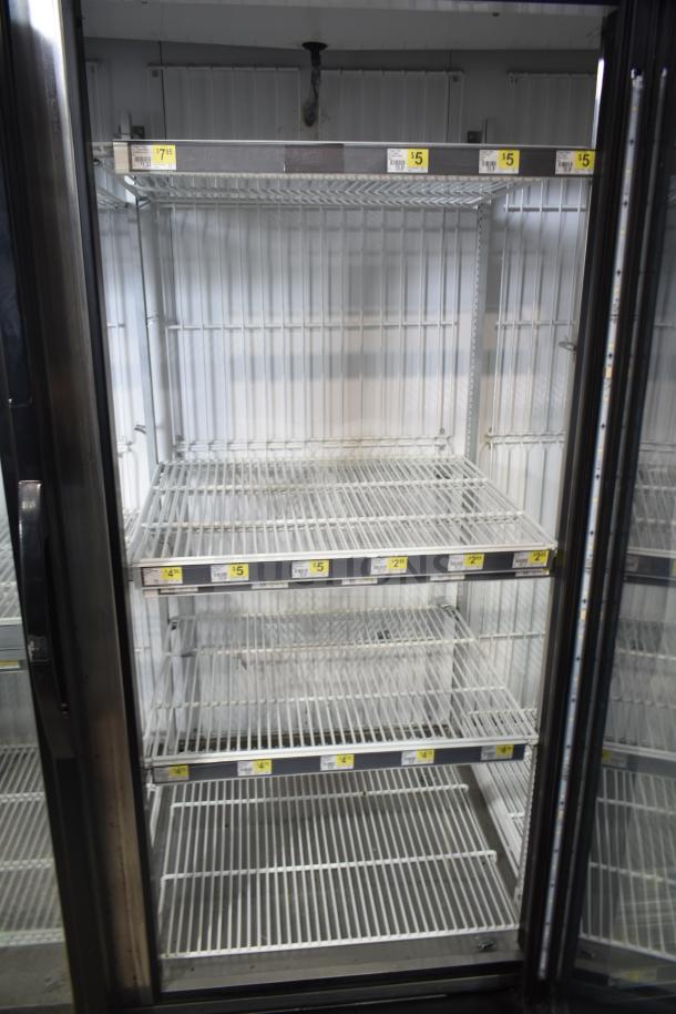 2017 True GDM-72F-HC 3-door commercial freezer, tested and working, features multiple shelves, 115/208-230V, 1 phase.