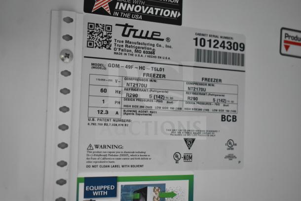 True GDM-49F-HC label showing model, voltage, refrigerant type R290, and safety warnings. Serial number 10124309.