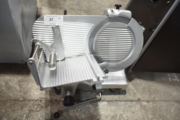 Brand new Estella 348SLM13 13" heavy-duty manual meat slicer with blade sharpener; 1/2 hp, 115 volts, 1 phase.
