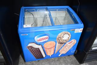 AHT RIO S 100 commercial ice cream freezer, blue with Nestle graphics, glass top, 110-120 volts, tested and working.