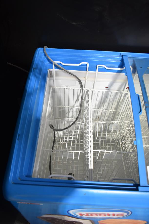 AHT RIO S 100 commercial ice cream freezer merchandiser, blue, tested and working, with internal wire baskets.
