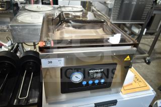 Brand new VacPak-It 186VMC16 chamber vacuum packaging machine with a 16" seal bar, oil pump, and digital display.
