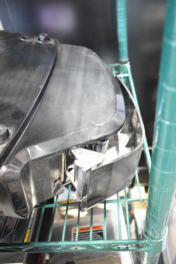 2017 Hobart HTi-7LH26 commercial scale, tested and working condition, on metal shelf. Black casing with visible wiring.