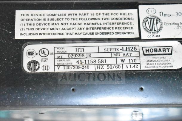 2017 Hobart HTi-7LH26 commercial scale label, 120/208-240V, 1 Phase, tested and working, model and compliance details visible.
