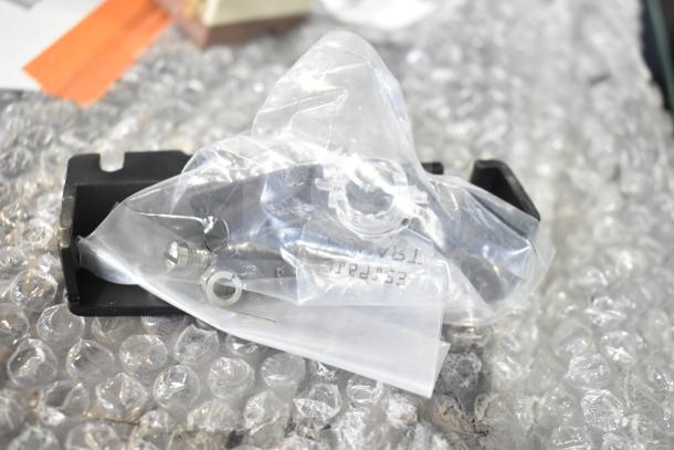 3 brand new, scratch and dent items: Vollrath Waffle Grate Bottom 922XCBL9003, 2 Avantco 177DPO1814 Thermostats, sealed in packaging.