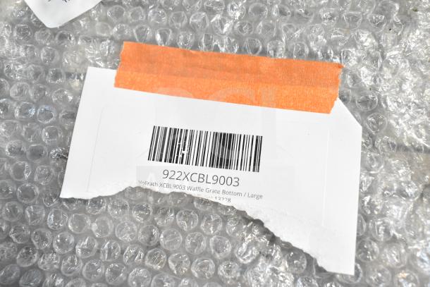 Label displaying Vollrath 922XCBL9003 waffle grate bottom description on bubble wrap packaging.