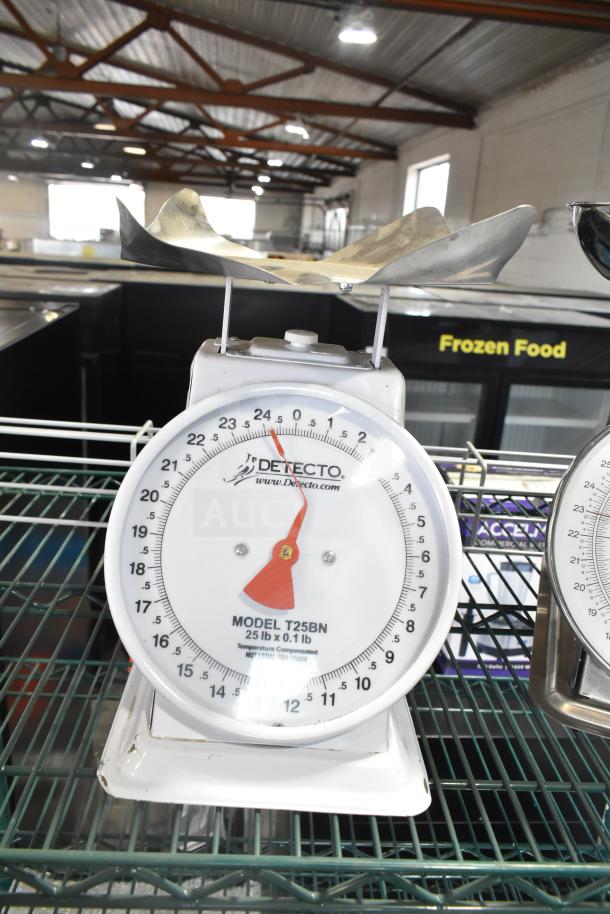 Detecto T25BN Scale on white metal rack, accurate to 25 lb x 0.1 lb, visible markings, in good condition.