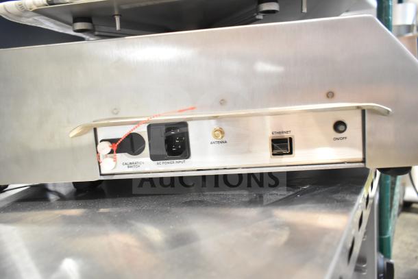 BRAND NEW Tor Rey W-LABEL40L 40 lb. scale, WiFi-capable with thermal label printer. Scratch and dent condition. Calibration switch, power input, antenna, Ethernet, on/off.