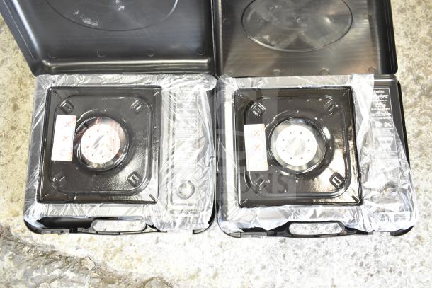 2 new Choice 472E10SL 1-burner butane stoves, 8000 BTU, in packaging, with minor scratches. Includes original labels.