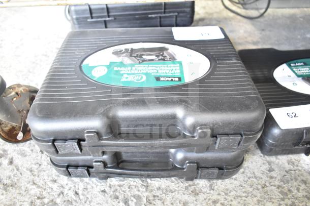 Two Choice 472E10SL butane stoves, 8000 BTU, in black cases, labeled "High Performance Portable Stove," scratch and dent condition.