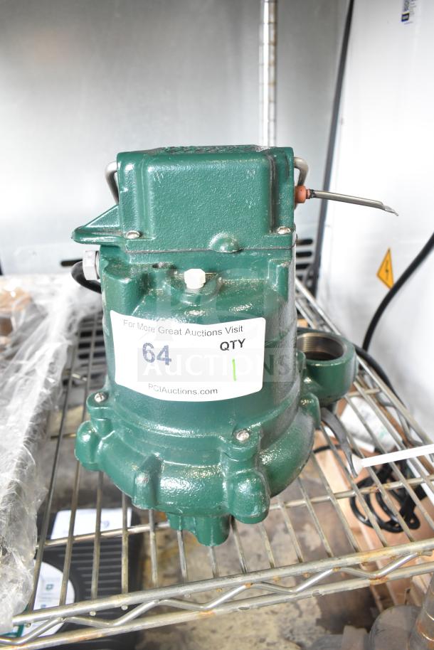 BRAND NEW SCRATCH AND DENT Zoeller M63 Sump Pump, 115V, 1 Phase. Green housing, label indicates auction info, model M63.